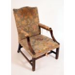 A 19th century mahogany Gainsborough armchair, rectangular back with serpentine cresting,