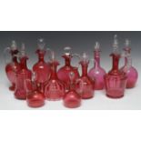 A Victorian cranberry glass decanter, ribbed clear glass handle, clear stopper, 27.5cm high, c.
