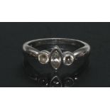 A modernist design diamond trilogy ring, central marquise cut diamond approx 0.