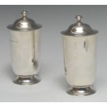 A pair of Arts and Crafts silver sugar casters,