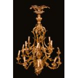 A Rococo design gilt metal eighteen light ceiling electrolier,