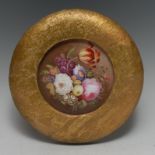 An early 19th century English porcelain circular plaque,