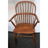 A Country House Windsor elbow chair, turned arm posts, saddle seat, H-stretcher,