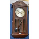 An early 20th century oak cased wall clock, silvered dial, Arabic numerals,