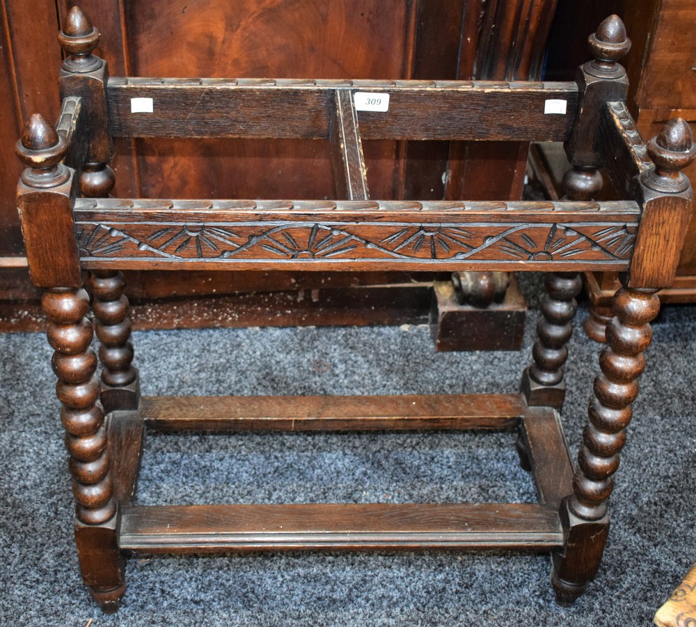 A 17th century style oak walking stick/umbrella stand