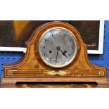 A mahogany mantel clock, silvered dial, Arabic numerals, twin winding holes,