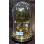 A Hermle brass anniversary clock, of small proportions, glass dome,