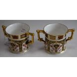 A Royal Crown Derby 1128 pattern two handled loving cup, printed mark; another,