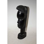 Tribal Art - a carved hardwood African bust, 23.