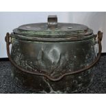 A large 19th century oval copper cooking vessel and cover,