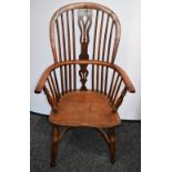 A Country House yew Windsor elbow chair, pierced splat, turned arm posts, elm saddle seat,