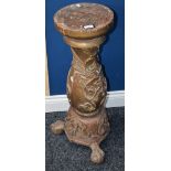 A 19th century carved wood statuary pedestal, ball and claw feet,