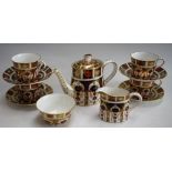 A Royal Crown Derby 1128 pattern tea set for four, comprising teapot, milk jug, sugar bowl,