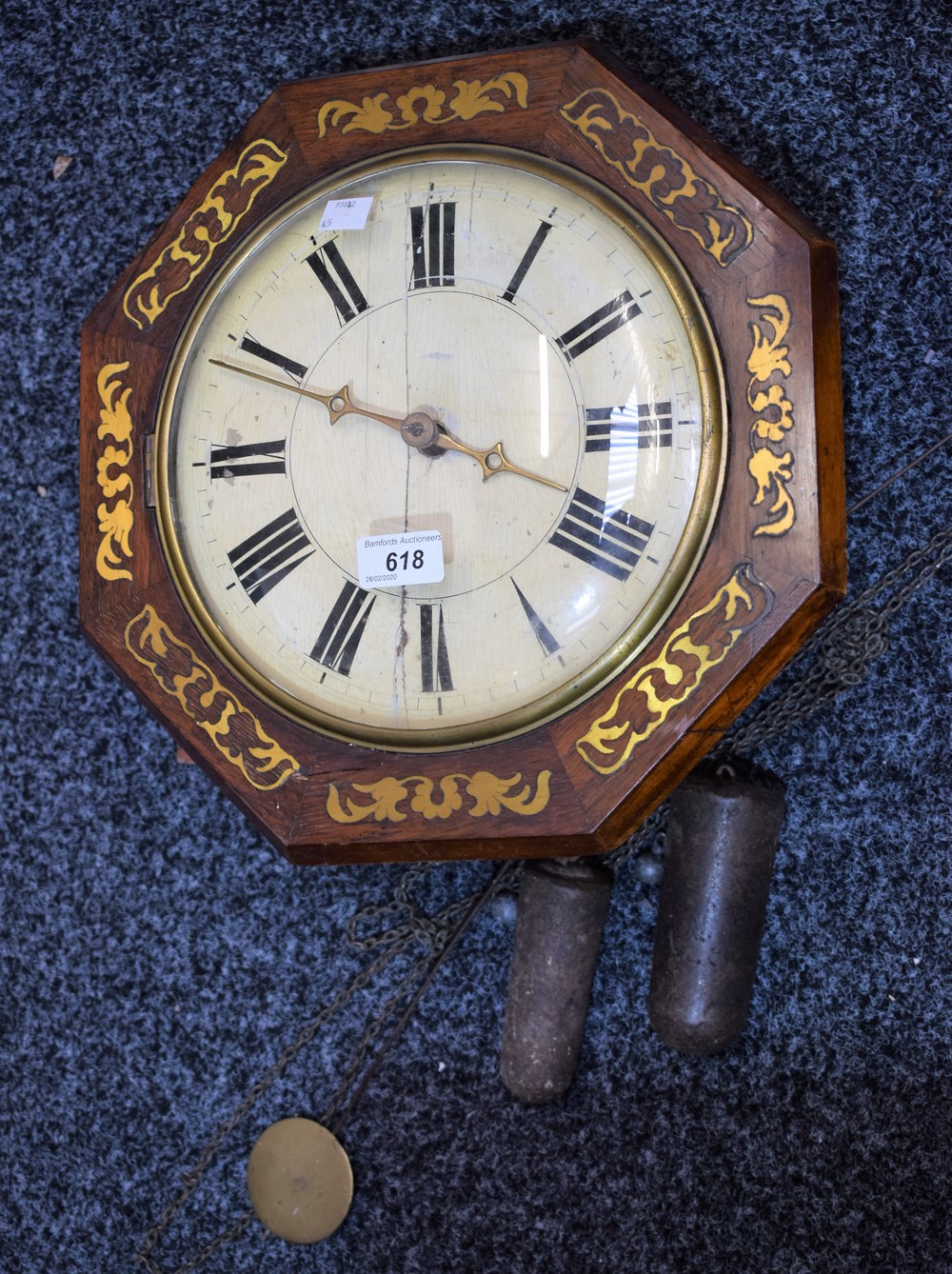 A brass inlaid mahogany wall clock