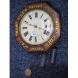 A brass inlaid mahogany wall clock