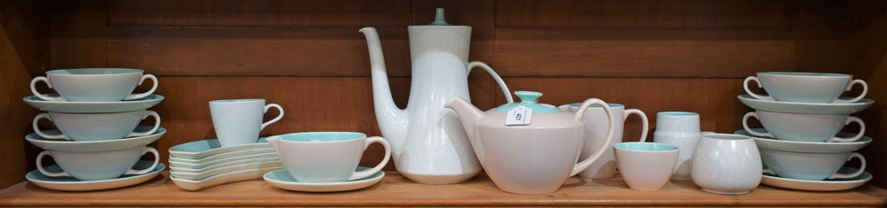 Poole pottery twintone including coffee pot, teapot, two handled soup bowls on saucers,