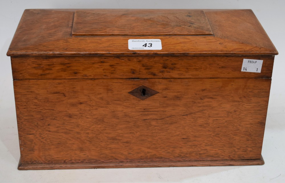 An oak rectangular tea caddy, the hinged top enclosing three compartments,