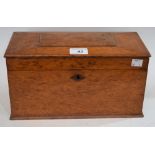An oak rectangular tea caddy, the hinged top enclosing three compartments,
