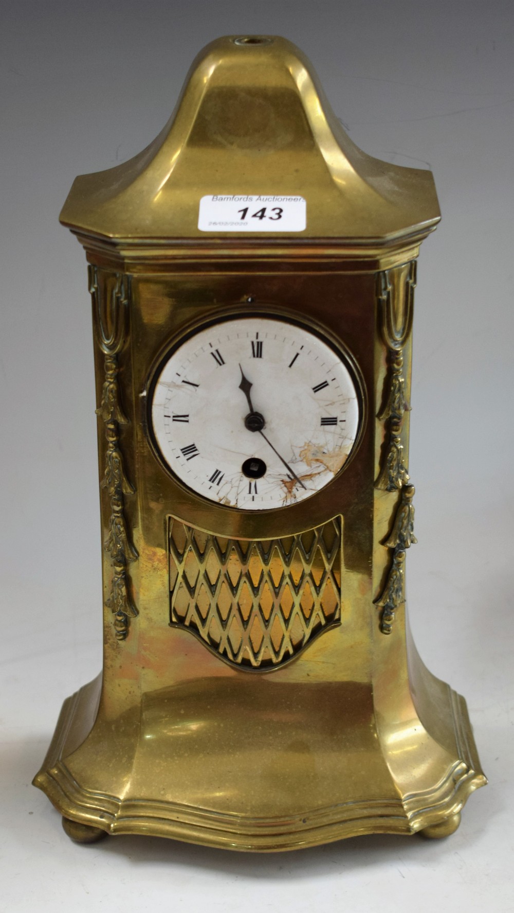A late 19th century French brass mantel time piece, architectural cast case, white enamel dial,