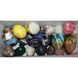 A quantity of decorative eggs including Isle of Wight glass, malachite, rose quartz, marble, onyx,