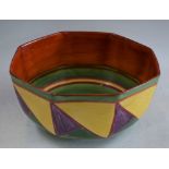 A Clarice Cliff Newport pottery octagonal bowl, geometric design in tones of orange, green,