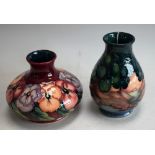 A contemporary Moorcroft Pansy pattern squat vase, maroon ground,