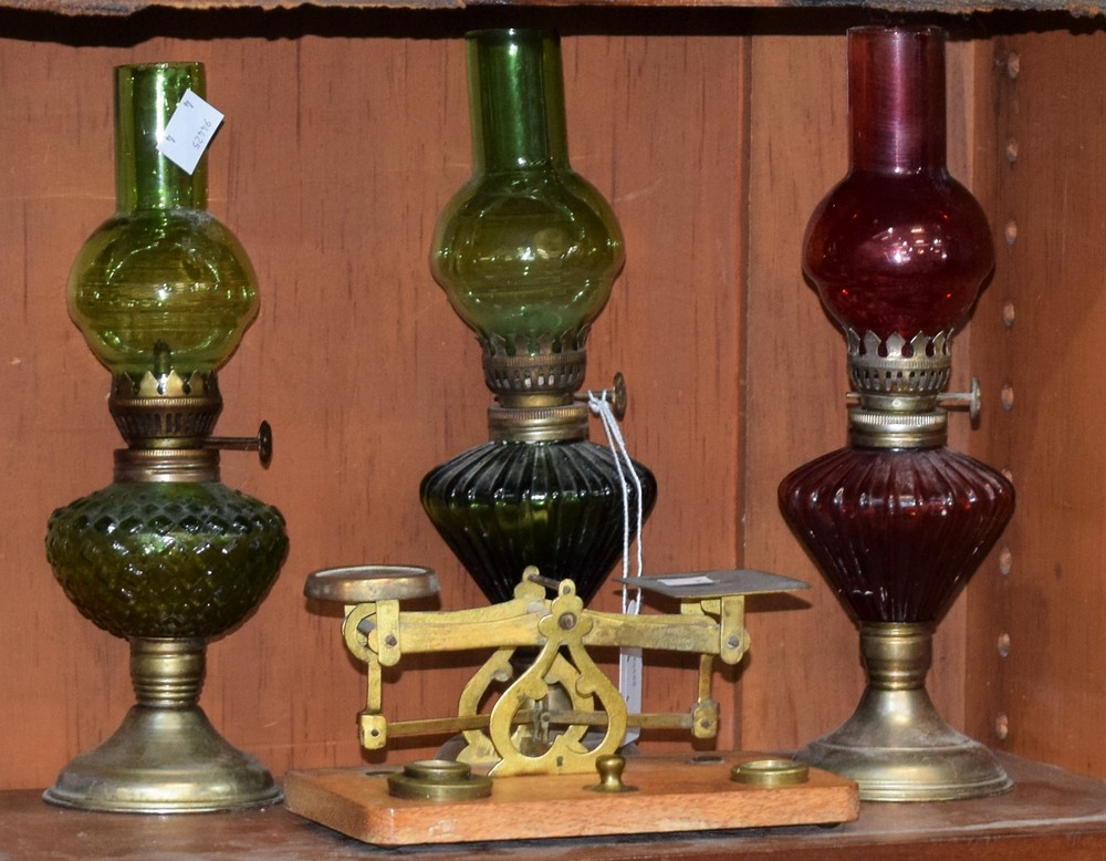Victorian postage scales and weights, by Criterion; a small red glass oil/paraffin lamp; two others,