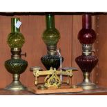Victorian postage scales and weights, by Criterion; a small red glass oil/paraffin lamp; two others,