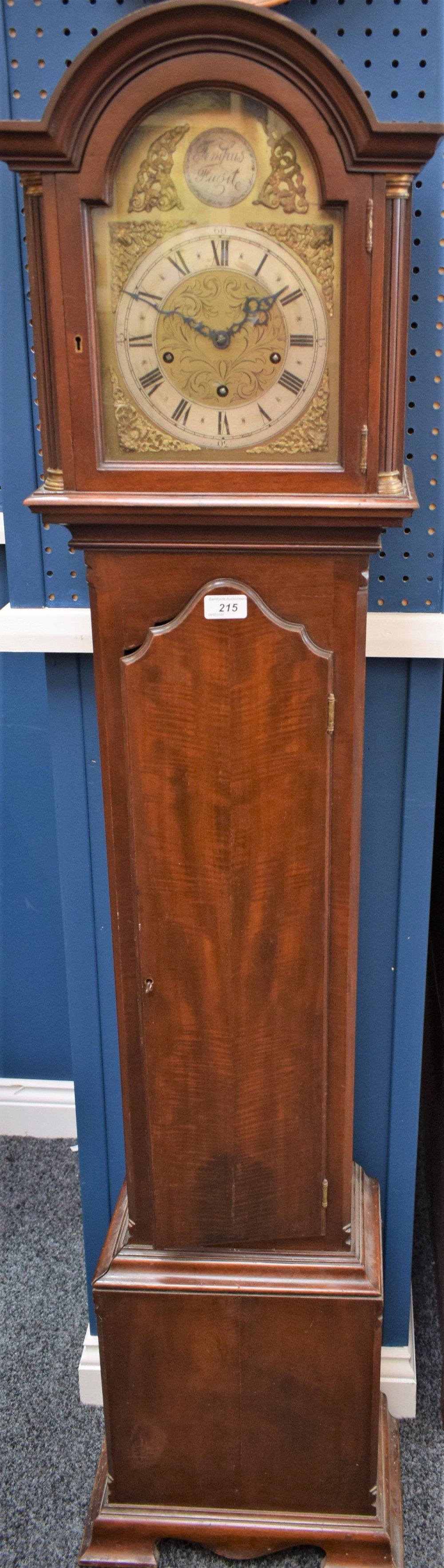 A mahogany 'grandmother' clock, arched dial with silvered chapter ring, Roman numerals,