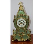 A Louis XV style mantel clock, painted enamel dial, Roman numerals, twin winding holes,