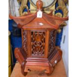 A pair of Oriental pagoda shaped table lamps, pierced work panels,