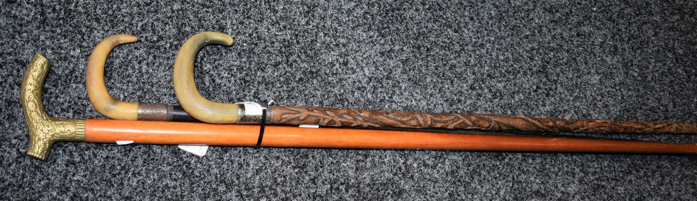 An early 20th century ebonised walking stick,