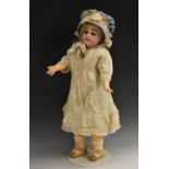 A Simon and Halbig bisque head doll, German 1850, with fixed blue eyes, feathered brows,