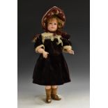A Societe Francaise de Fabrication de Bebes bisque head character doll, with oopen blue glass eyes,