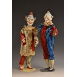 An early 20th century bisque head clown doll, with cymbals, 29cm high, marked 117; another,