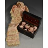 An unusual sewing doll, with sleeping blue eyes, wearing a long dress, as a needle case,