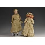 An all bisque doll`s house doll, with open blue eyes, closed mouth, blond wig, jointed limbs,