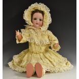 An Armand Marselle bisque doll.