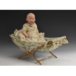 A German bisque head baby doll, Gebruder Heubach, 77 43, painted blue intaglio eyes, approx.