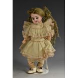 An Armand Marseille bisque head doll, sleeping glass brown eyes, open mouth, with three upper teeth,