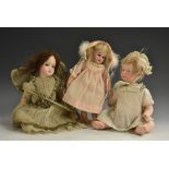 A French bisque head doll, Montanari, fixed blue eyes, brown wig, dressed as a fairy,
