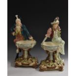 A pair of Austrian figural sweetmeat dishes, of a dandy and companion,