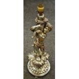 A large chromed metal table lamp base in the form of a cherub
