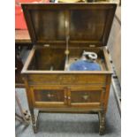 An oak Geisha gramophone cabinet,