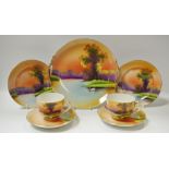 Noritake - cabinet plate decorated with swans on a lake and two cabinet cups and saucers