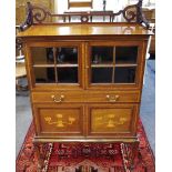 An Art nouveau mahogany cabinet, shaped 3/4 gallery,