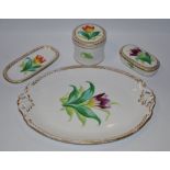 An English Botanical part dressing table set, brightly decorated with tulips, c.
