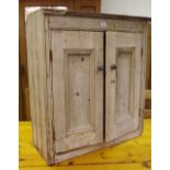 A Victorian rustic pine side cupboard, two panel doors enclosing shelving,