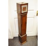 An early 20th century oak grand daughter clock,