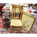 An Eastern silkwork fire screen; a mahogany three tier cake stand;